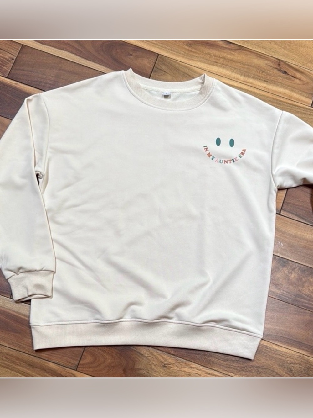 Cream Crewneck Sweatshirt with Subtle Smile “In My Auntie Era” Graphic
